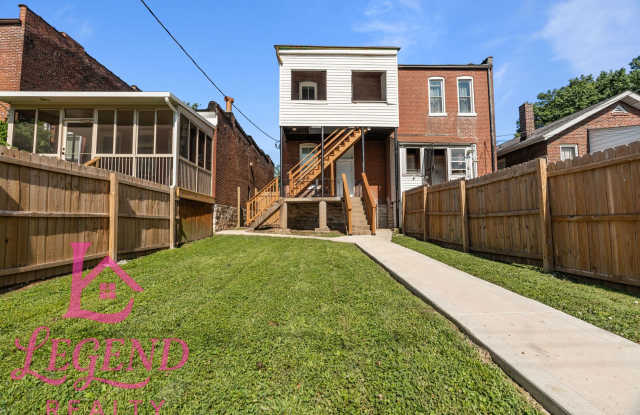 Completely Renovated 4BR Brick Home with 3 Full Baths & Off-Street Parking Gallery 4