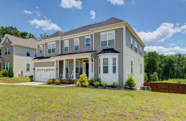 Welcome to 2286 Harvestwood Lane, a luxurious 5-bedroom, 4.5-bath home nestled in the serene community of Chapin! Gallery 3