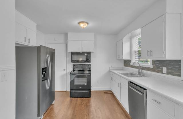 Renovated 4 Bed/ 2 Bath plus office in Madison, Large Kitchen, Living Room and Den, Hardwoods, Tile, Carport Gallery 4