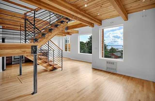 INDUSTRIAL-STYLE QUEEN ANNE TOWNHOUSE WITH VIEWS OF THE WATER FROM EVERY FLOOR! photos photos