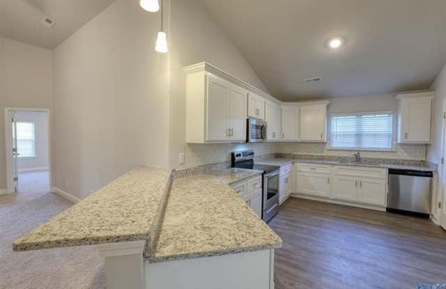 Fall in love with this stunning 4-bedroom, 3-bathroom full-brick ranch home photos photos