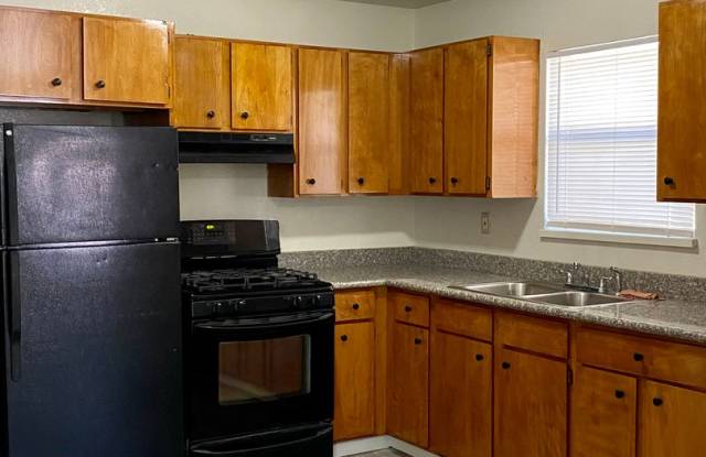 3 bedroom unit with private laundry. 2 OFF STREET PARKING SPOTS! photos photos