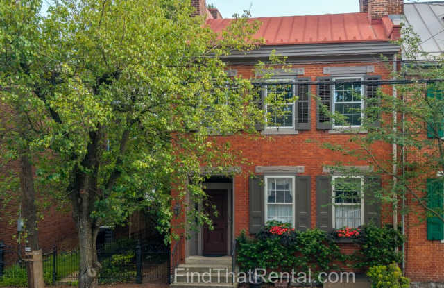 AVAILABLE NOW! Restored historic downtown Carlisle rental with fenced yard, pond, balcony, and hardwood floors photos photos