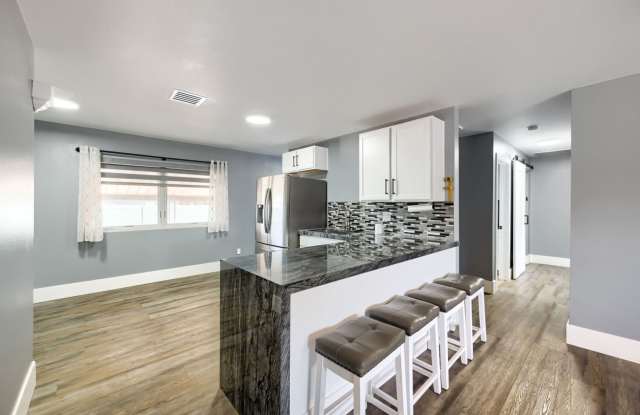 MODERN REMODELED 2 BEDROOM HOME WITH SOLAR & HUGE BACKYARD! Gallery 1