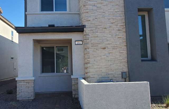 Contemporary townhome with modern exterior and attached garage. photos photos