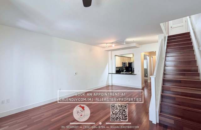2-bed, 1.5-bath two-story condo, with rich hardwood floors, a modern kitchen, and spacious bedrooms with natural light. located above bustling Bay St. with shopping and restaurants steps away. Gallery 3