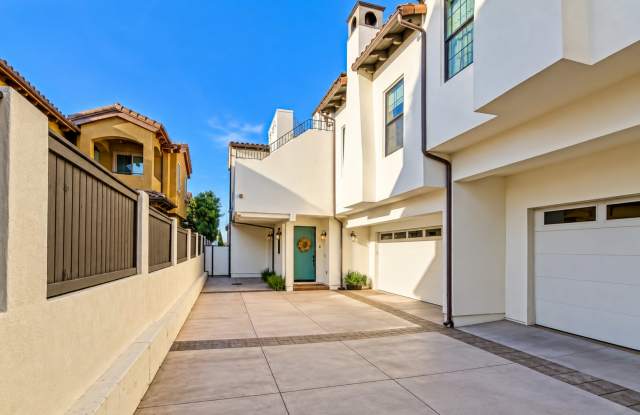 Upscale & Spacious, Spanish Style Tri-Level Townhome w/ Amazing Great Room Living Space, Rooftop Deck, 2 Balconies, Rear Yard & 2-Car Garage Close to Schools, Shopping & Just 2 Blocks to MB Border & 5 Mins to Beach! Gallery 4