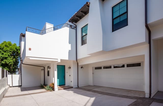 Upscale  Spacious, Spanish Style Tri-Level Townhome w/ Amazing Great Room Living Space, Rooftop Deck, 2 Balconies, Rear Yard  2-Car Garage Close to Schools, Shopping  Just 2 Blocks to MB Border  5 Mins to Beach! photos photos
