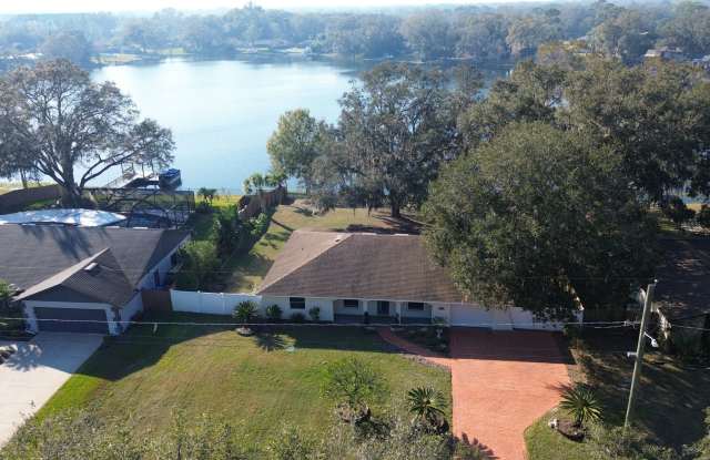 Discover your Waterfront Dream Home with Private Dock on Tranquil Lake Sinclair - 15414 North 15th Street, Lutz, FL 33549