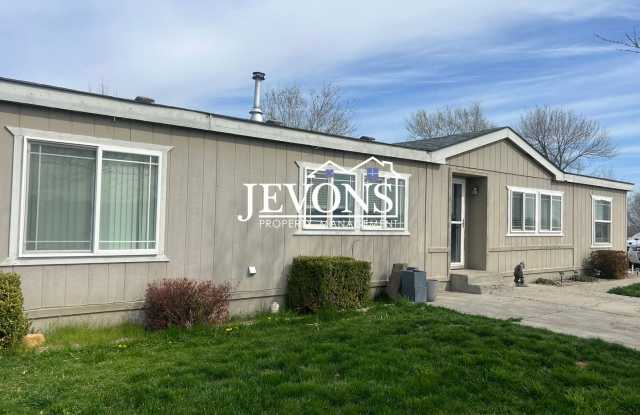 4-bedroom single-family home with 1 fenced acre, plus a large shop and shed photos photos