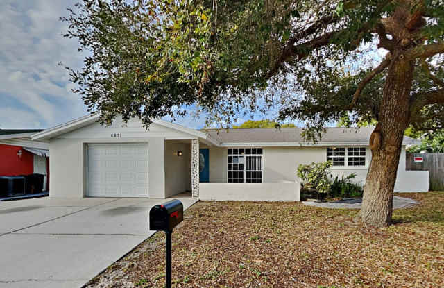 Charming 3-Bed, 2-Bath Home in Port Richey with Garage photos photos Charming 3-Bed, 2-Bath Home in Port Richey with Garage photos photos