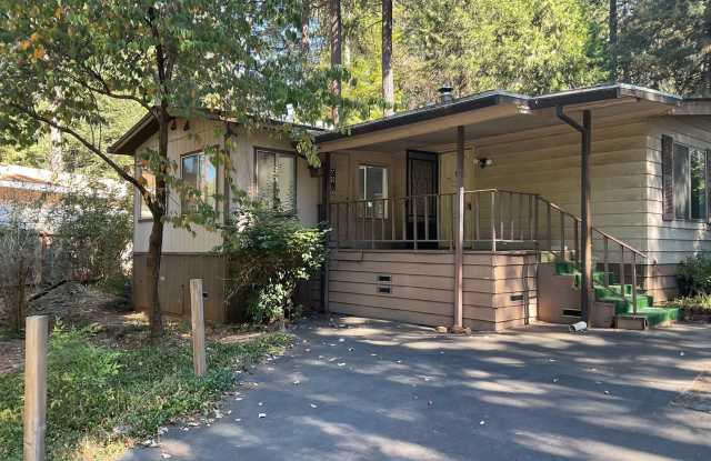 Magalia 2 bed 2 bath home + 2 bonus Rooms with detached garage and carport-partially fenced back yard Gallery 1