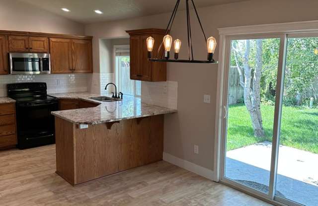 4-Bed Meridian Retreat Featuring Flexible Layout & Private Backyard (6- 7) month lease available Gallery 3