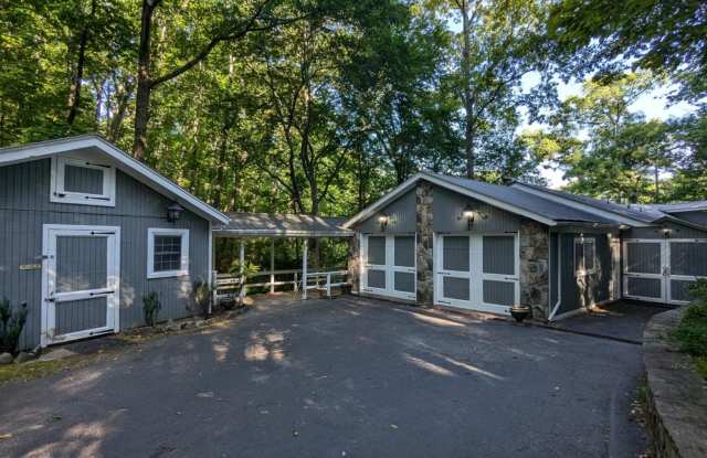 Unique Lake Lanier front home w/spectacular natural rock waterfall and dock photos photos
