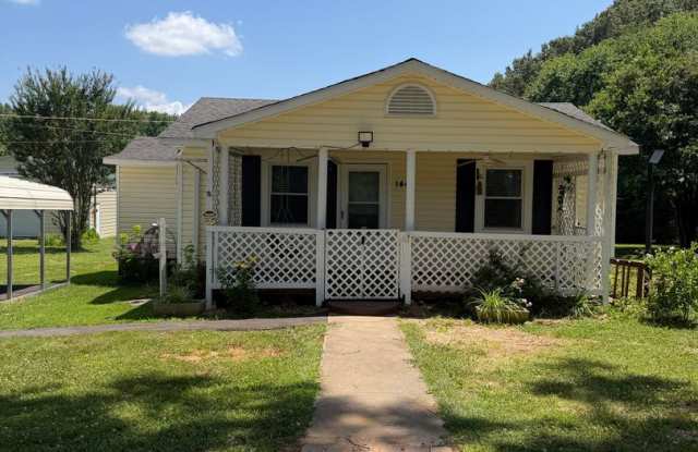 Charming 2-Bedroom Home with an Enclosed Sunroom & Peaceful Outdoor Living photos photos