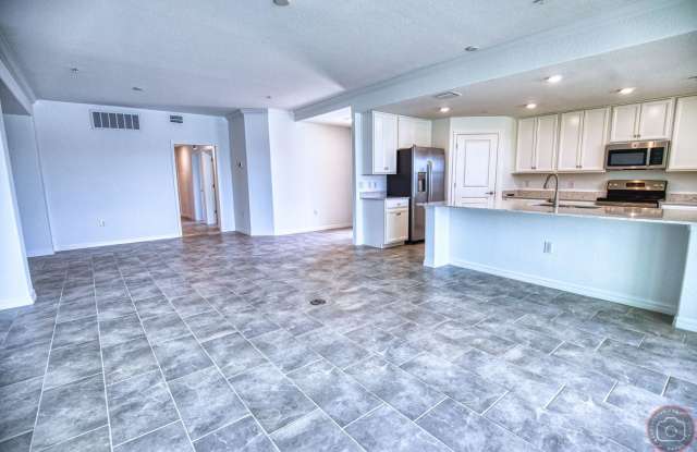 Annual Unfurnished Rental – Coach Home 3 Bedrooms, 2 Baths, 2 Car Garage, with Resort Like Amenities – Gran Paradiso Community! photos photos