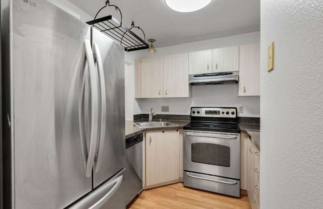 2 level condo, 3 decks, Stainless Appliances, 2 parking spots, Water, sewer, garbage included! Gallery 4