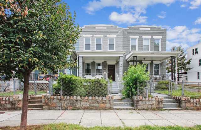 Modern 4BR Home w/ Fireplace, In-Law Suite + Parking in Prime DC Location! photos photos