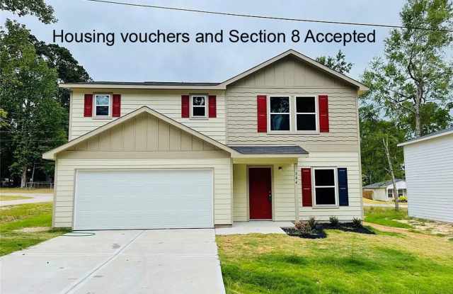 Beautiful New 2 story home in the gated Cedar Point Community in Lake Livingston!! photos photos