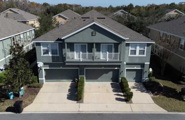Beautiful second-floor, 2-bedroom, 2-bath condo with peaceful lake views and an attached 1-car garage Gallery 1