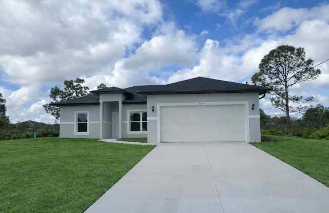 MOVE IN READY  BRAND NEW! Spacious 4 BD/ 2BA/ 2 Car Garage in Lehigh Acres photos photos