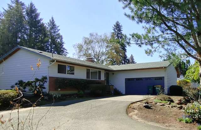 Welcome to this Mid-Century Modern Ranch with a Daylight Basement Located in Garden Home. photos photos