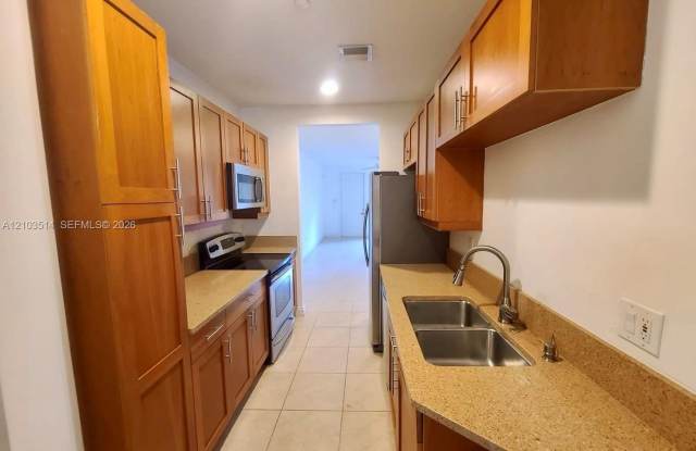 Spacious 1/1 in Sailboat Bend Village, featuring an in-unit washer and dryer and assigned parking. Gallery 4