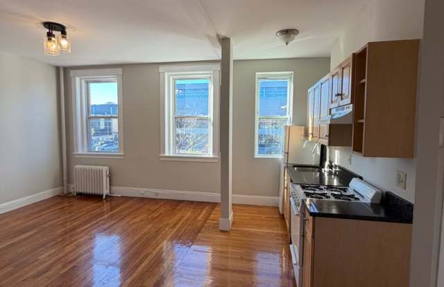 Gleaming hardwood floors in updated STUDIO Gallery 1