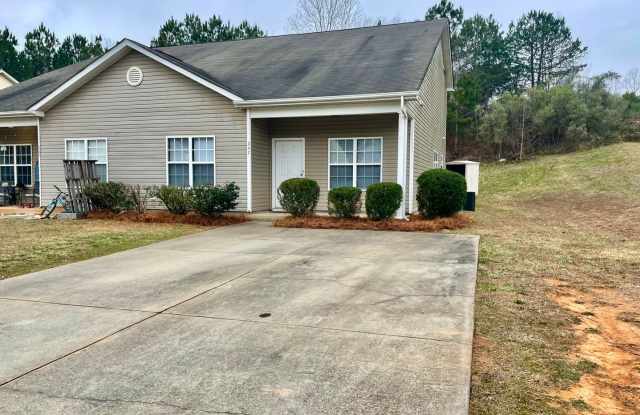 This two-story, 4-bedroom, 2-bath duplex in Fort Mill, SC sits on a corner lot photos photos