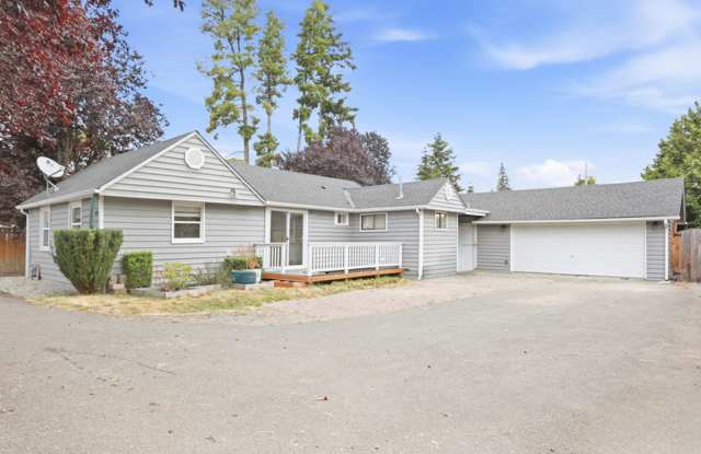 Updated Rambler with covered patio and large detached garage. Gallery 1