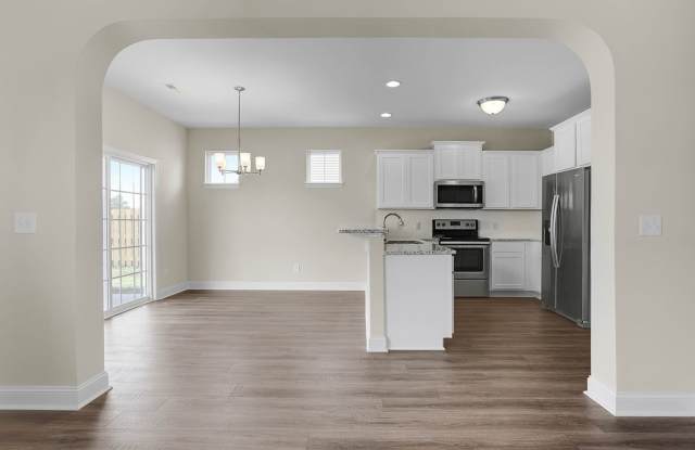 Beautiful home with a charming wrap-around front porch and open floor plan! Gallery 4