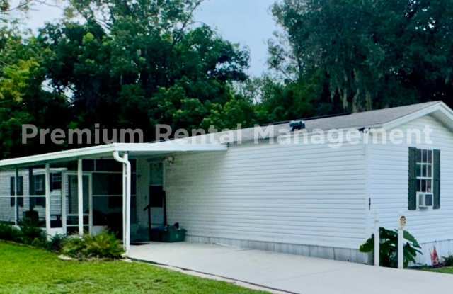 Three bedroom two bath Castleberry manufactured home with a screen porch and carport! photos photos