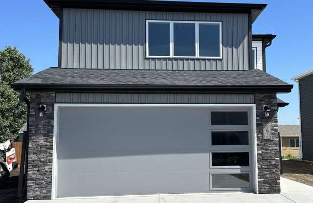 Welcome to 102 Marshall Loop,. located in the highly sought-after Moon Ridge Development in Lincoln, ND! photos photos