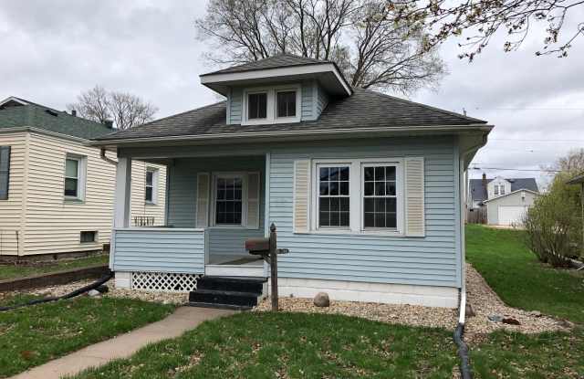 Charming 2-Bedroom Home with Basement & Backyard Storage Gallery 1