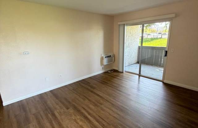 2BR/1BA Lakeside ground floor condo with 1 car detached garage, 1 uncovered parking space & community pool. Gallery 3