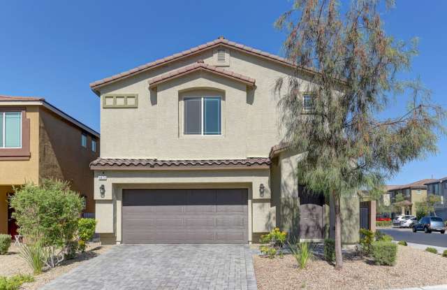 BEAUTIFUL TWO-STORY HOME FEATURING ATTRACTIVE DESERT LANDSCAPING. photos photos