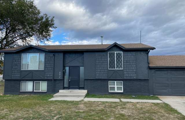 Updated 4-Bedroom Home with Huge Backyard & 2-Car Garage photos photos