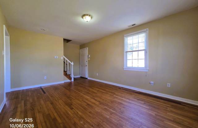 Cape Cod in Southside on large corner lot with private back yard. Gallery 4