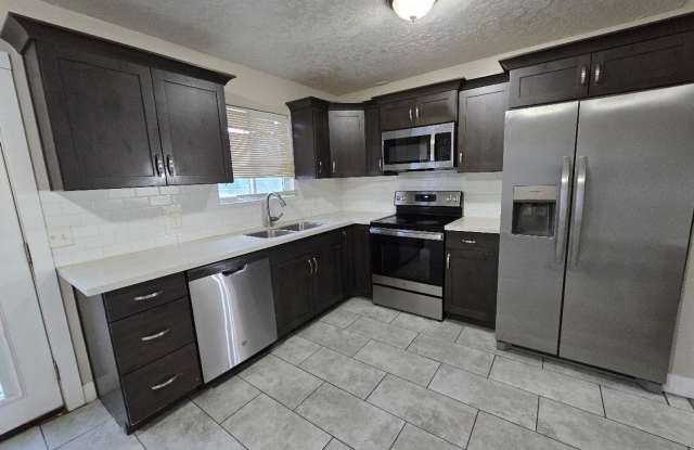 Spacious 5-Bedroom Magna Home with Deck and Ample Parking photos photos