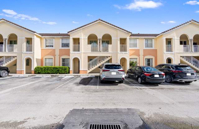 2-bath condo on the 2nd floor with a newly renovated kitchen featuring modern cabinets and granite countertops. photos photos