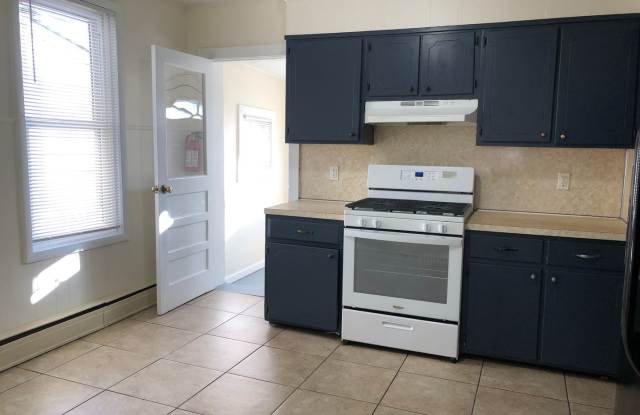 Great Home! Spacious and Updated! Wood Flooring! New Window! Eat-in-Kitchen! Yard! Gallery 4