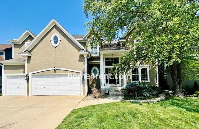 Beautiful Four Bedroom Home in a Quiet Neighborhood w/ an Updated Kitchen, Wood Floors, and a Finished Basement! photos photos