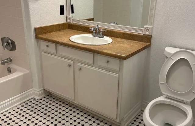 Spacious single-story, ground-level corner unit located in a desirable gated community. Gallery 3