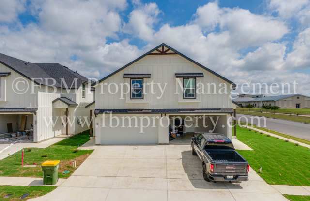 912 Cooksey Ct, Unit A - Brand New 3 Bedroom, 2.5 Bathroom Townhome in Grandview, TX! $500 OFF at Move-In! photos photos