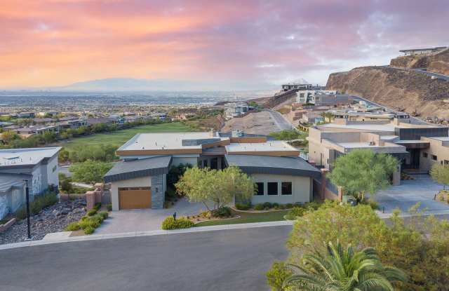 UNUBSTRUCTED VIEWS FROM THIS MACDONALD HIGHLANDS CUSTOM HOME HIGH ABOVE THE LAS VEGAS VALLEY photos photos