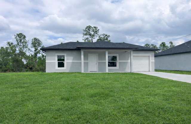NEW CONSTRUCTION- Modern 1 Bd / 1Ba / 1g Home in Lehigh Acres photos photos