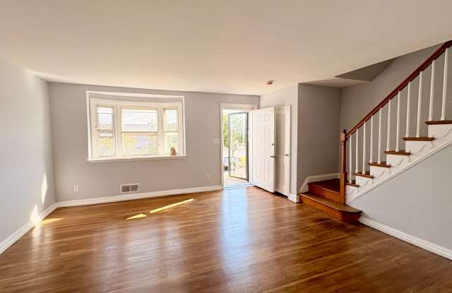 Charming Brick Home with Finished Basement, Modern Kitchen  Spacious Yard photos photos