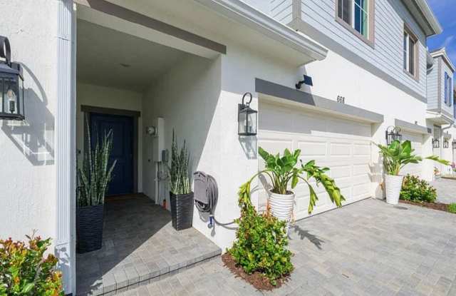 3 Bedroom 2.5 Bathroom Townhome with 2 Car Garage and Fenced Patio!**ASK ABOUT MOVE IN SPECIAL** - 668 Waters Edge Lane, Port St. Lucie, FL 34983