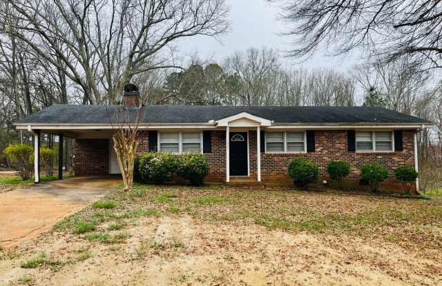 Charming 3-bedroom, 1.5-bath brick ranch situated on a large private lot in Carrollton! Must see! photos photos