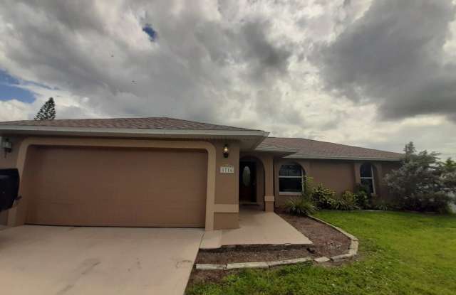 Freshly painted interior and new kitchen appliances ! 3/2 Home with large fenced back yard - 1716 Northeast 12th Street, Cape Coral, FL 33909